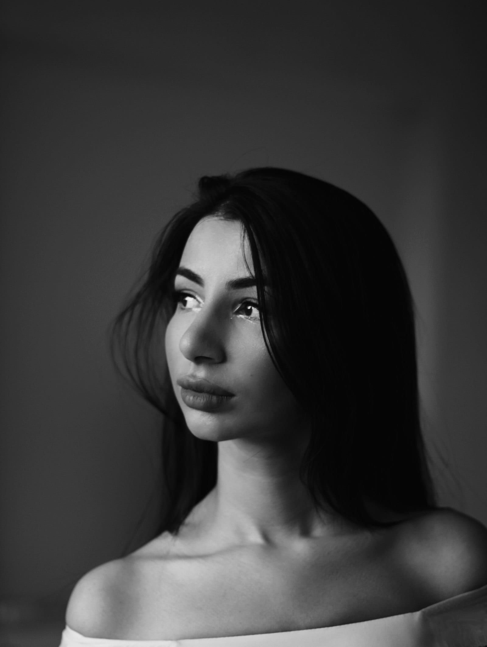 A woman in profile, in black and white